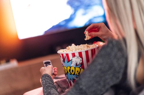 watching tv with popcorn