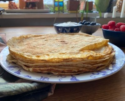 a pile of thin crepes on a plate