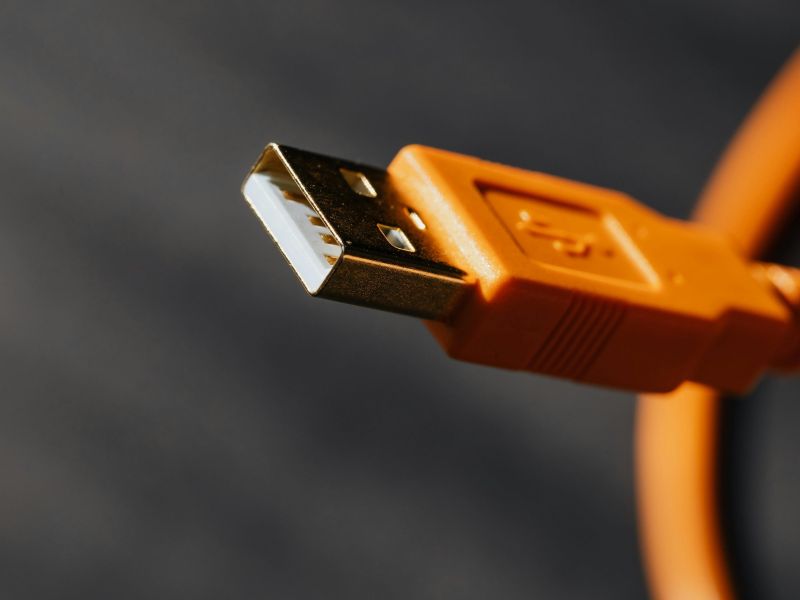 Photo of an orange cable with a usb connection