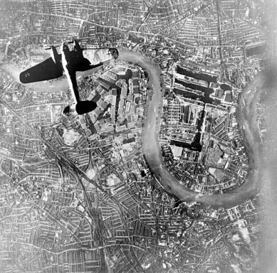 black and white birds eye view image of a plane over london