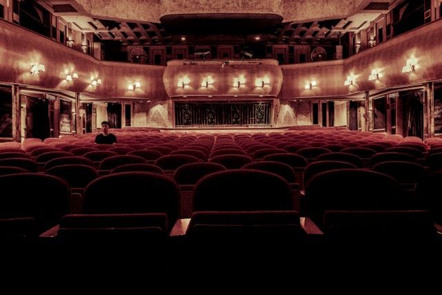 old fashioned cinema with red velvet chairs