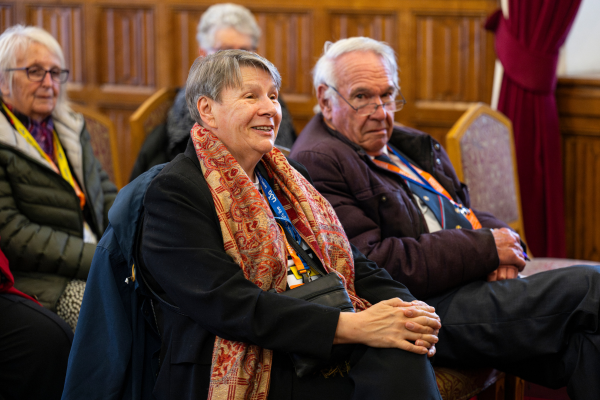 four u3a members sat down in a wood panelled room