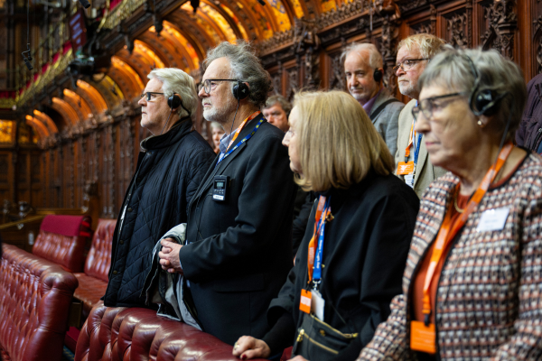 people standing in the house of lords chamber