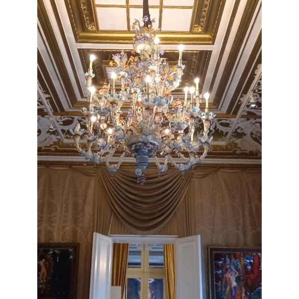a big chandelier made of glass in a grand room