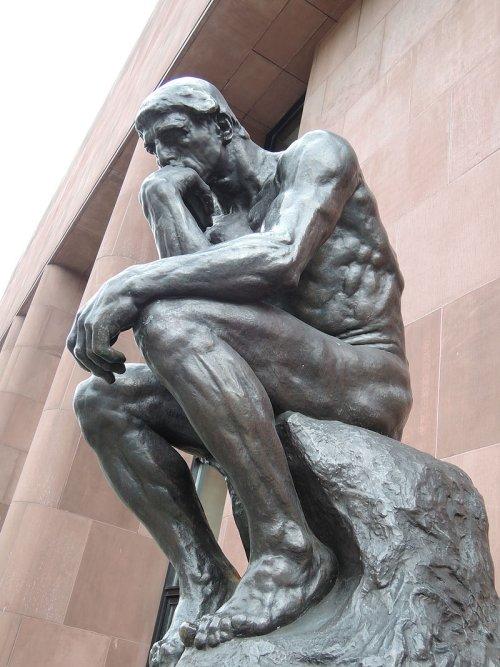 statue of a man thinking