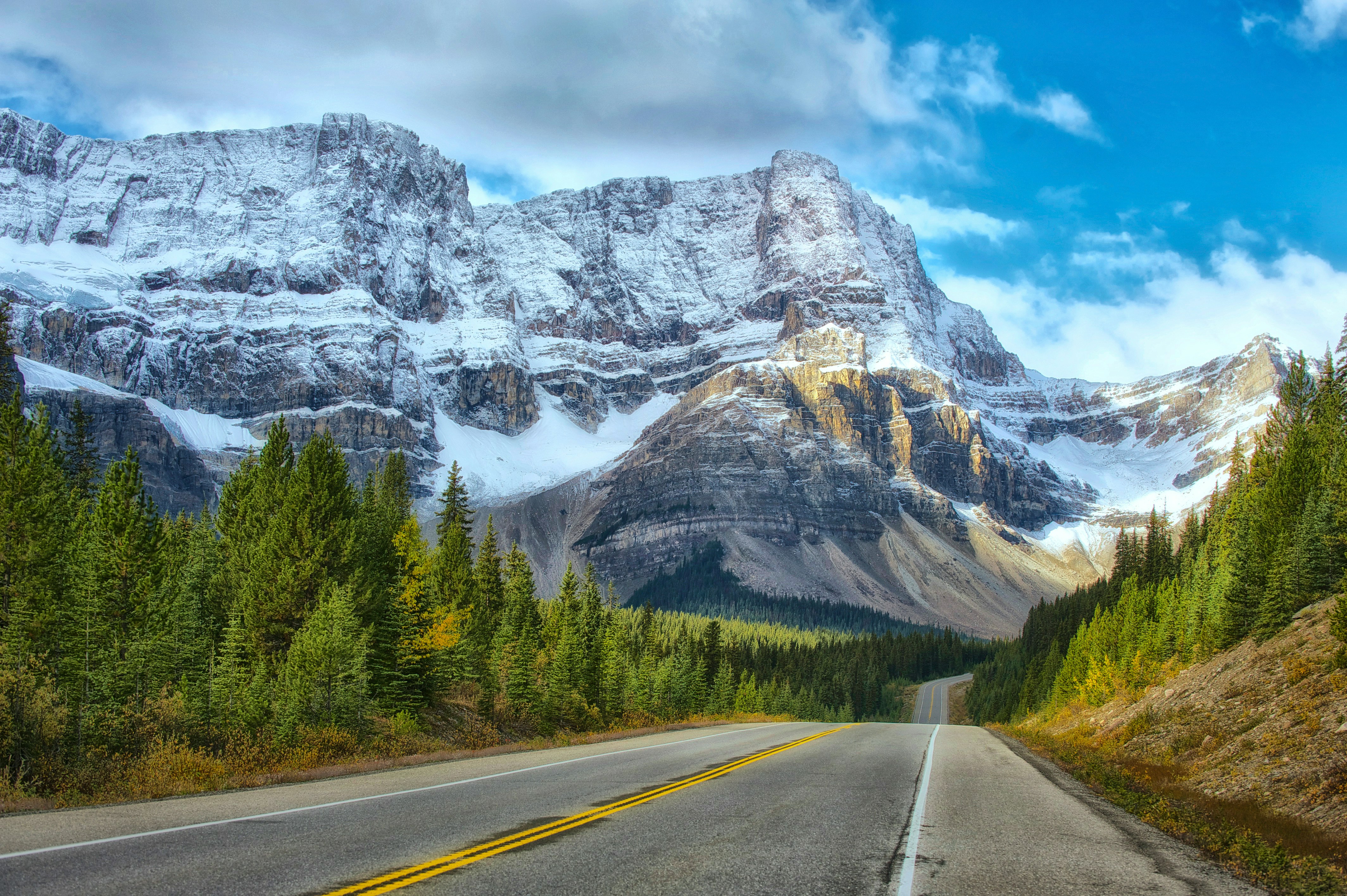 a road leading to a mountain in canada