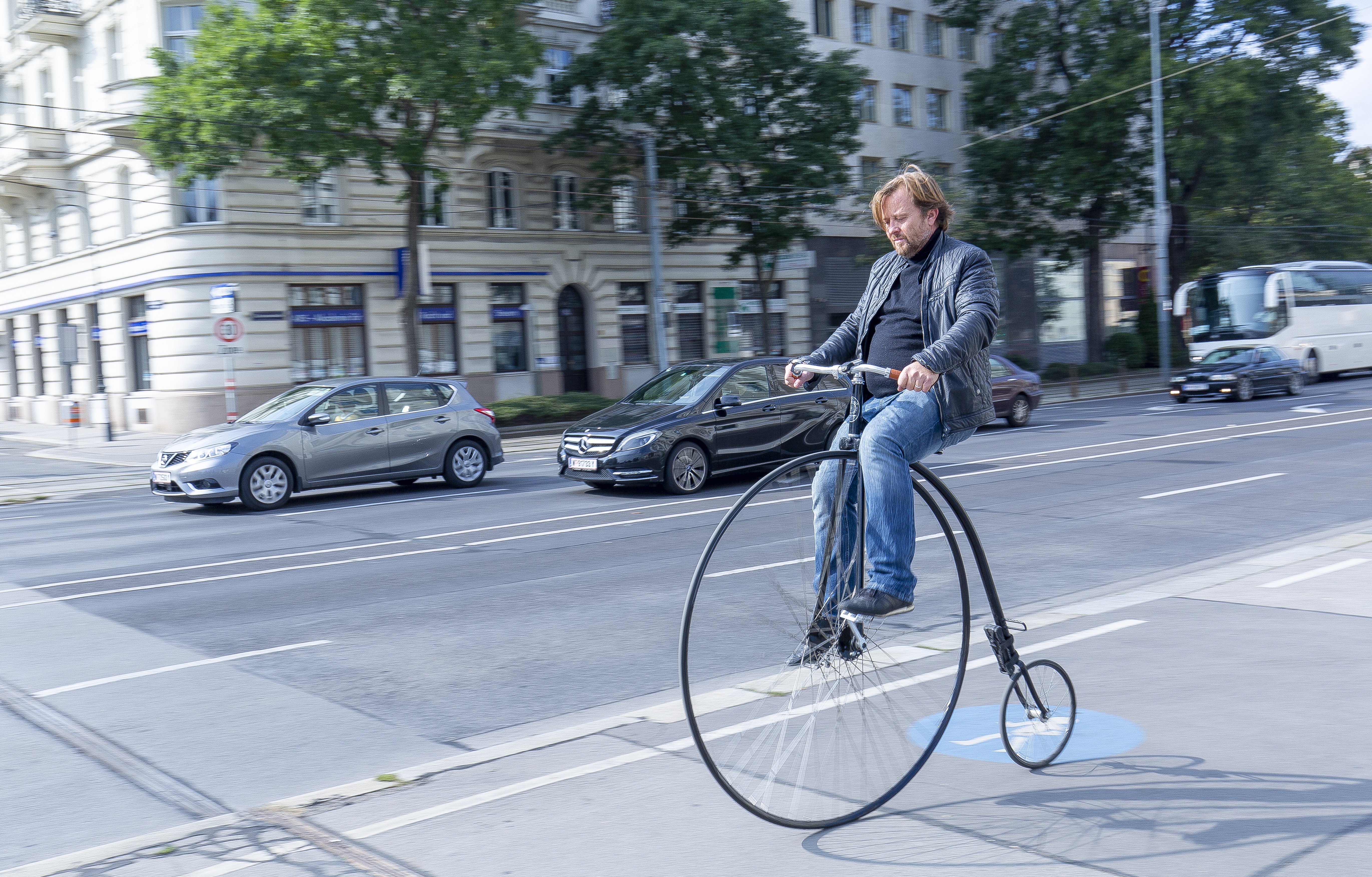Pennyfarthing with man riding