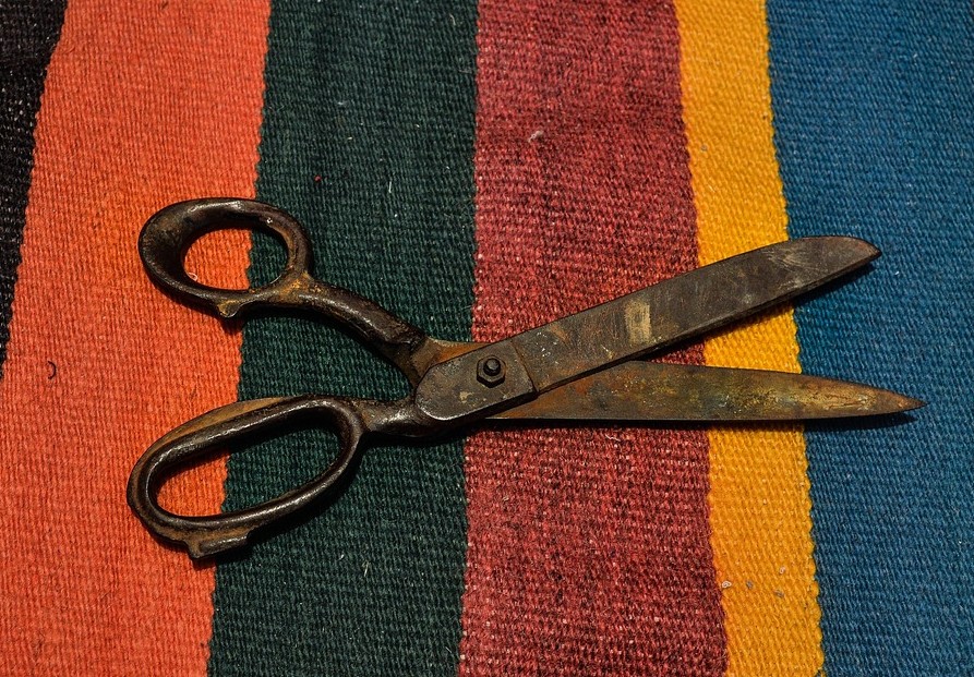 photo of scissors on a striped rug