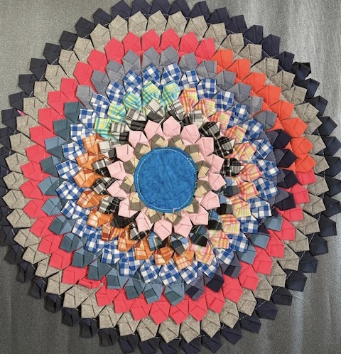 intricately patterned place mat brightly coloured