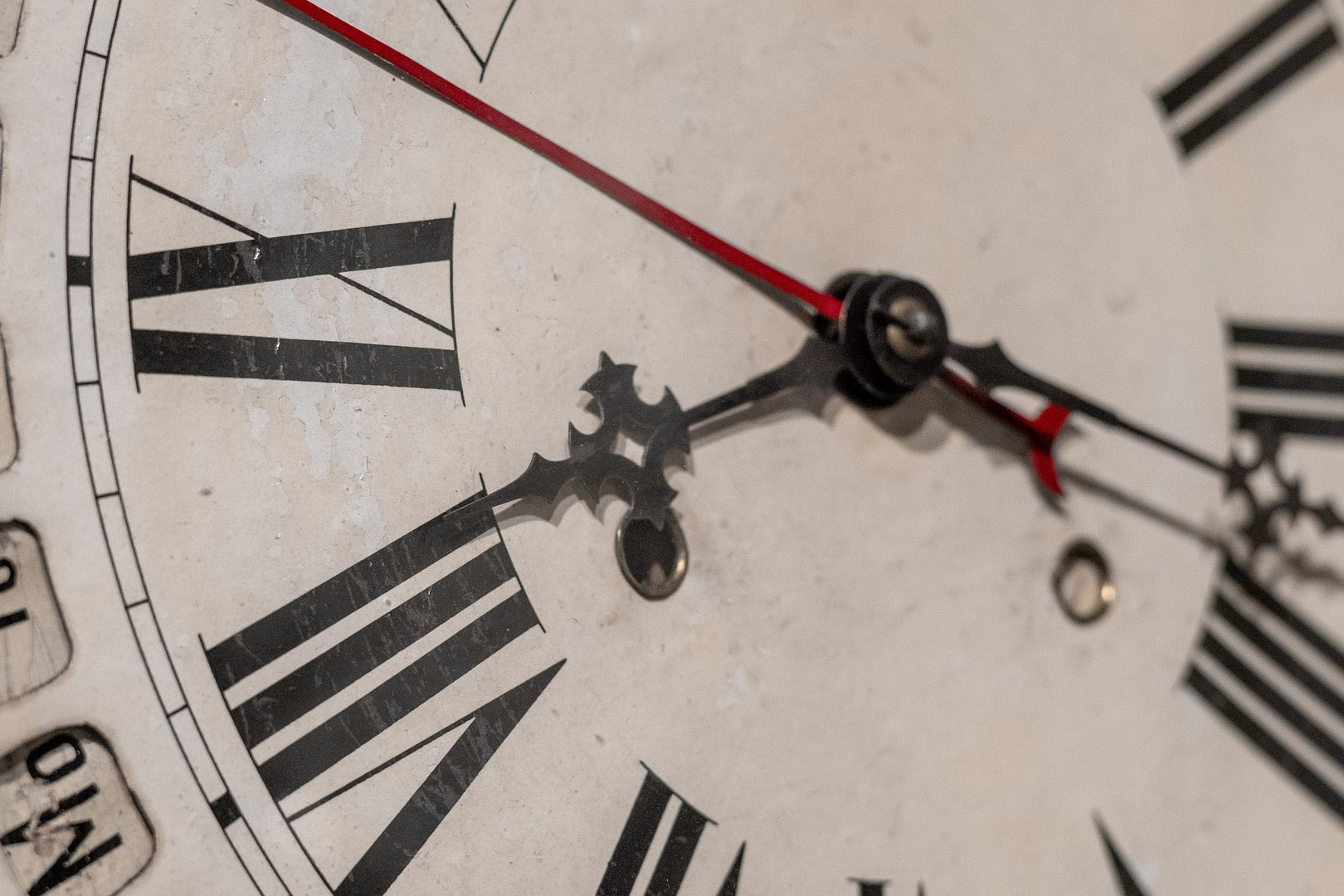 a zoom in of a grandfather clock clock face