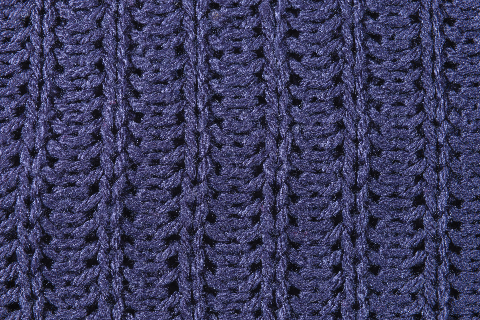 zoomed in photo of purple knitted fabric