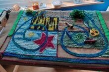 Photo of an almost completed hooked rug