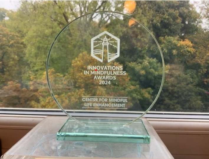 Photo of a glass 'Innovations in Mindfulness' award