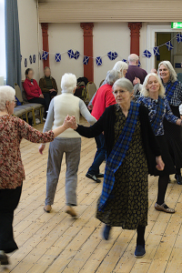 Members dancing together