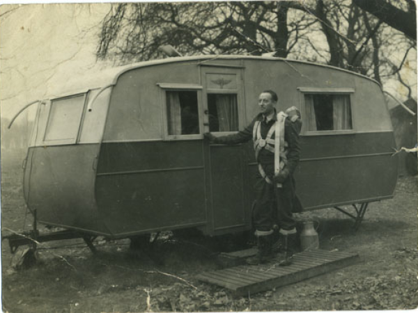 Black and white photo of Agate and his caravan