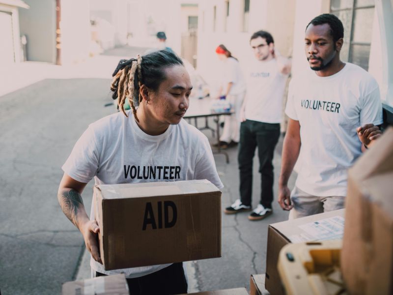 Volunteers help to distribute aid