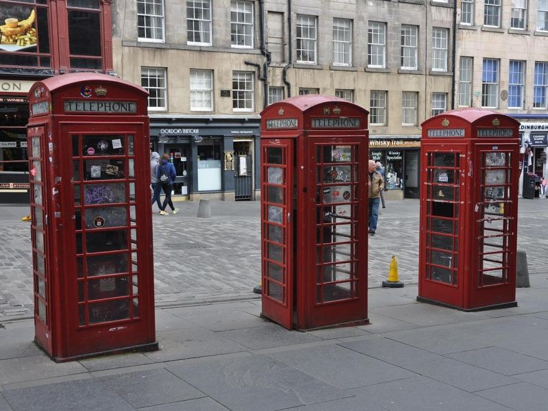 Photograph of three red phone boxes