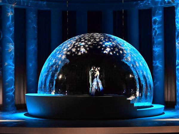 Photo of performers in a dome on stage
