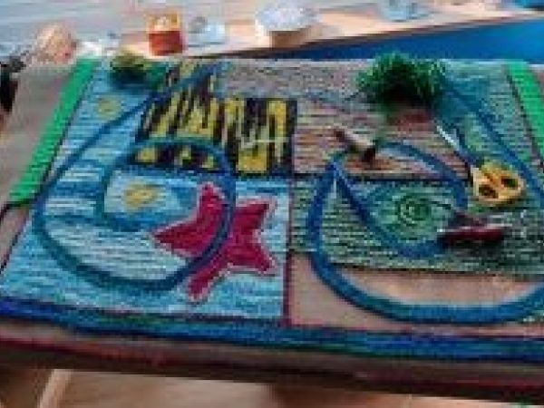 Photo of an almost completed, hooked rug