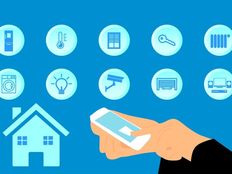 Illustration of a hand with remote control and various icons for appliances