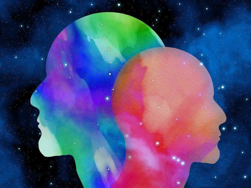 Graphic of two human heads with colours among stars