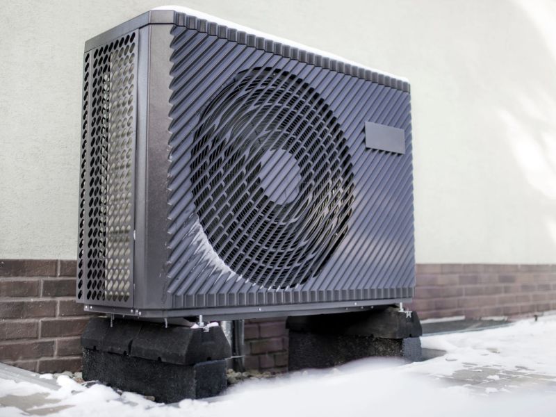large rectangular metal heat pump outside