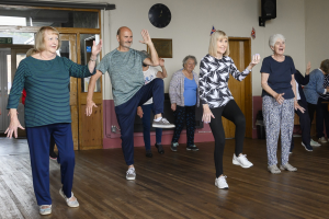 A group of men and women doing tai chi