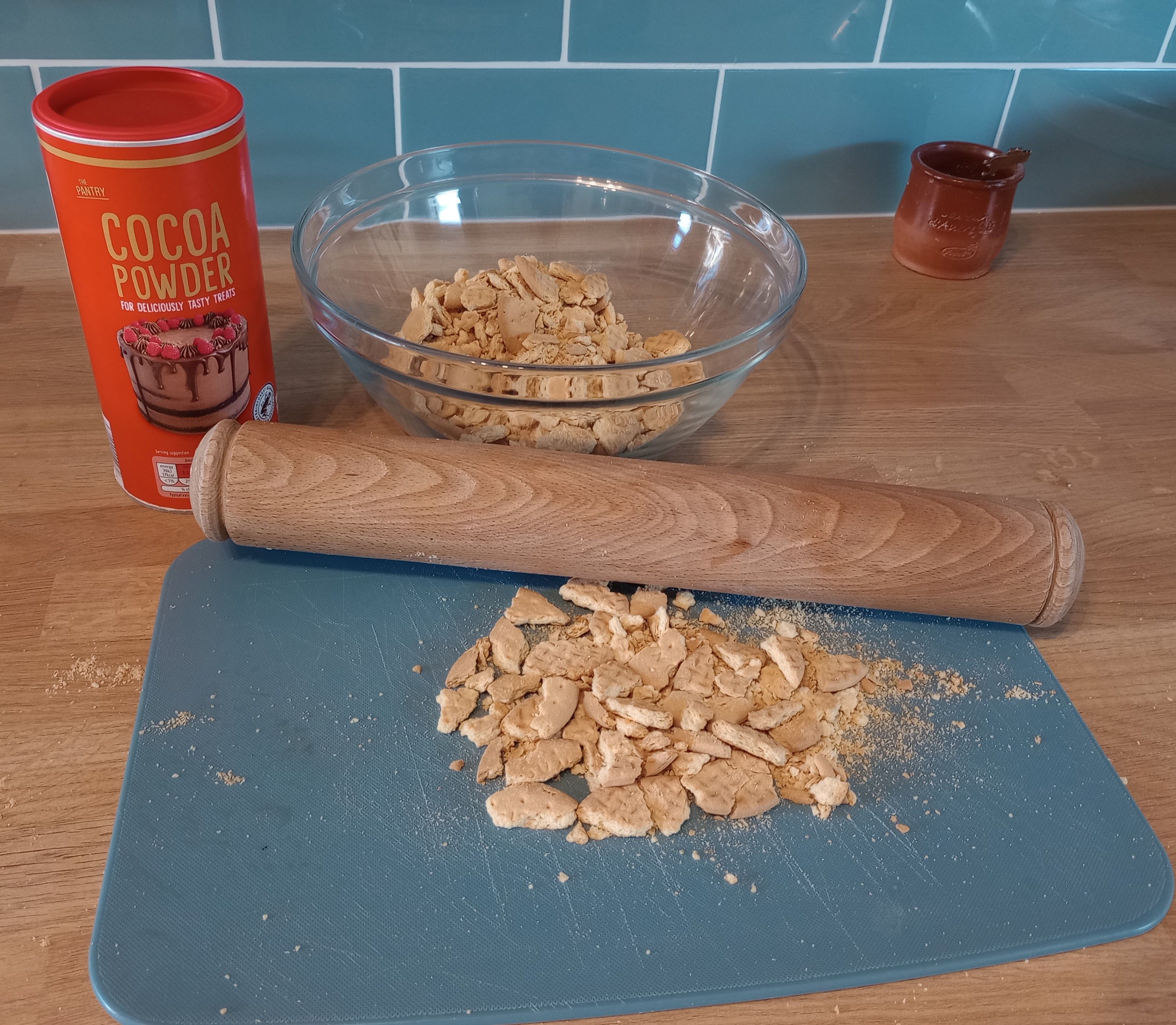Photo of crushed biscuits and a rolling pin