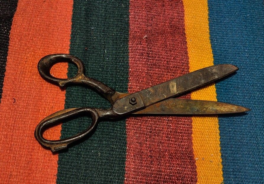 photo of scissors on a striped rug