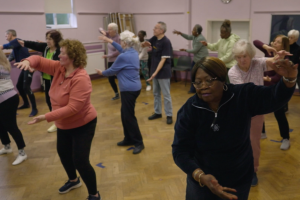 A group of people doing Tai Chi