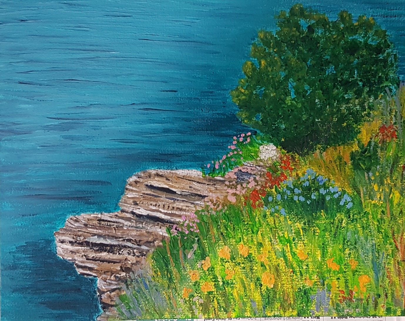 an acrylic painting of the coast with a flowered grass on the right of it