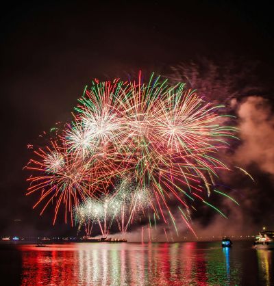 Photo of night sky with red and green fireworks