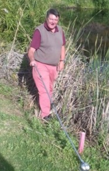 John finding balls on the golf course